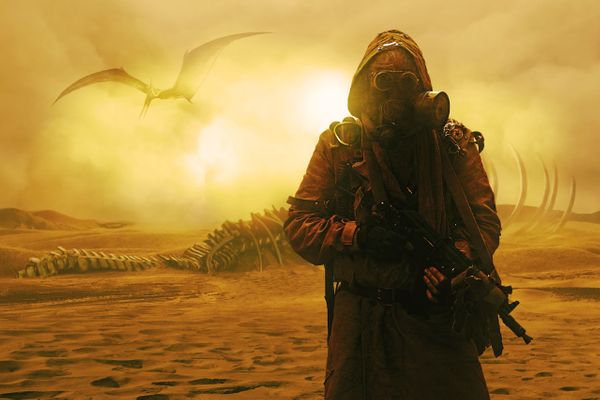 Image of a soldier moving through a desert with prehistoric creatures in the distance