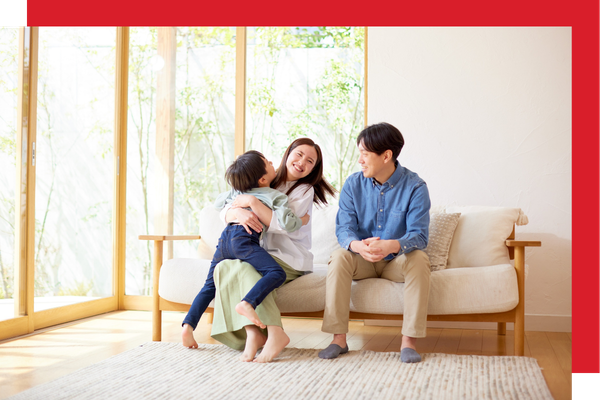 family sitting on couch breathing in clear air