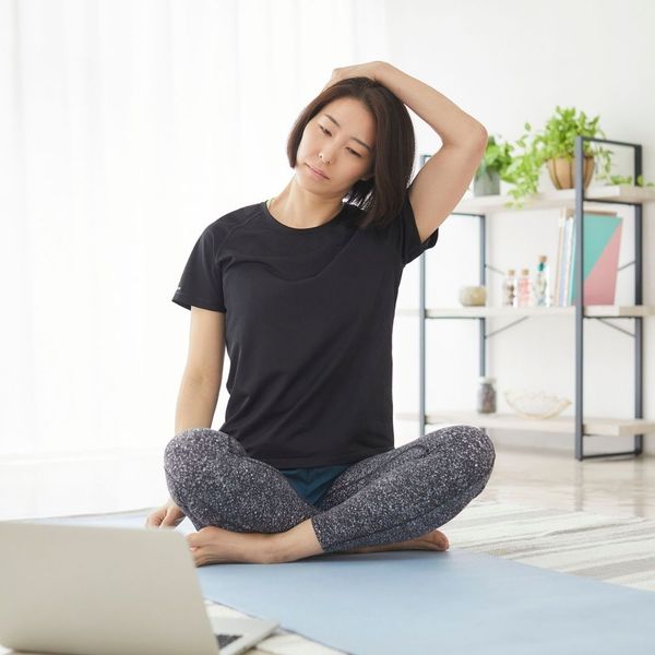 woman working on physical therapy exercises at home