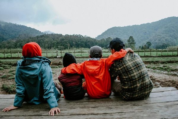 family sitting on porch 