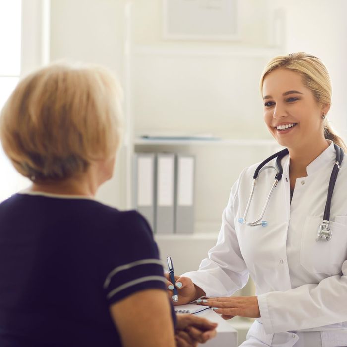 Doctor speaking with older woman