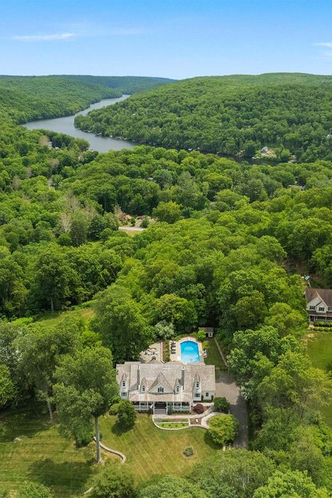 drone shot of luxury home among trees