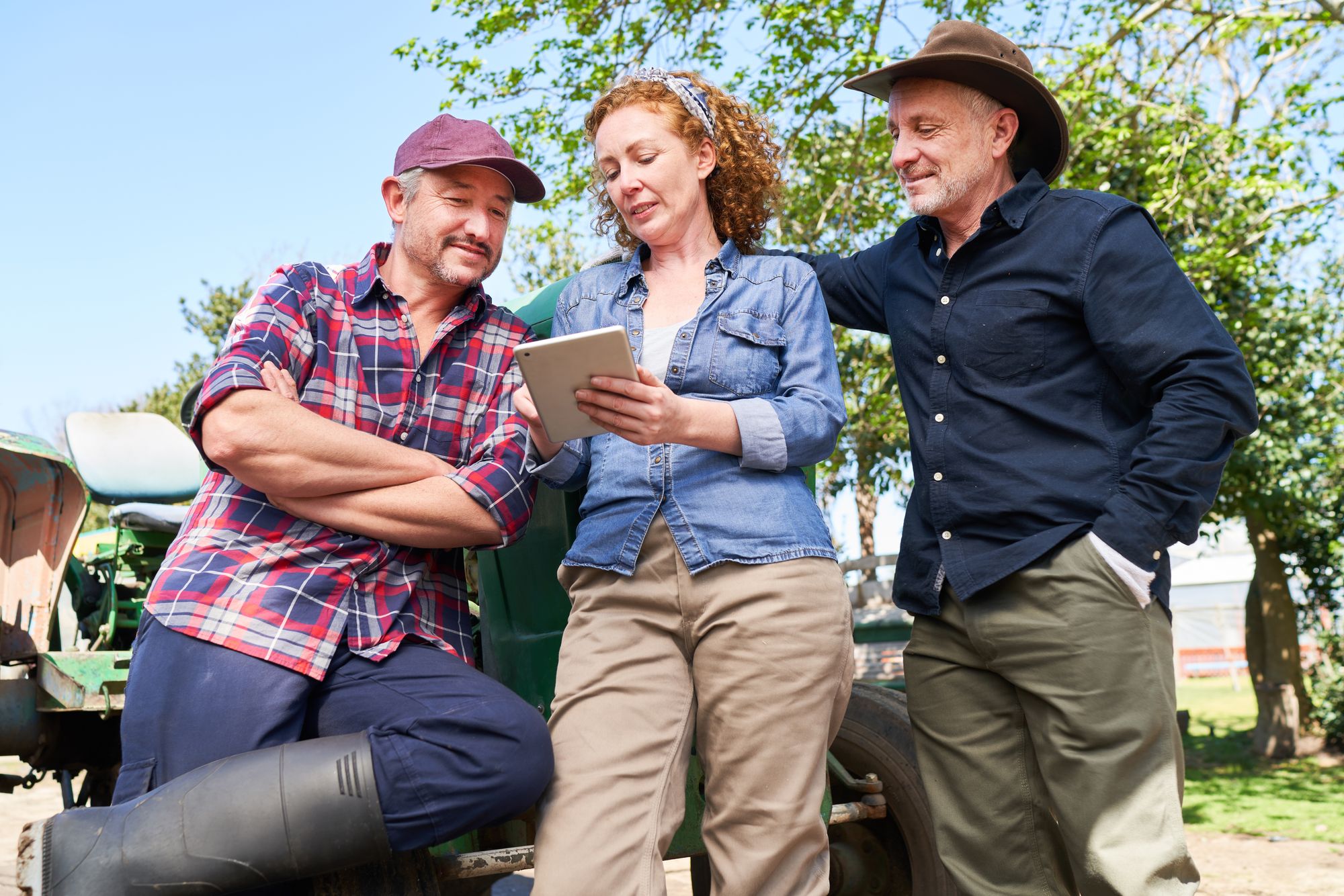2 men and lady farmers discussing.jpg