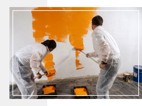 Two people painting walls. Two people painting walls.