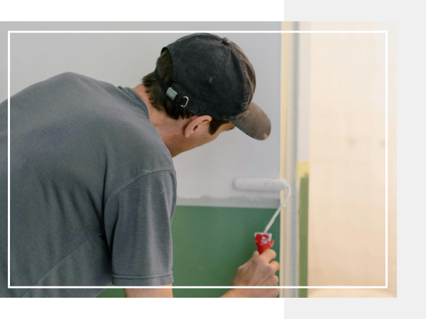 Man painting walls.