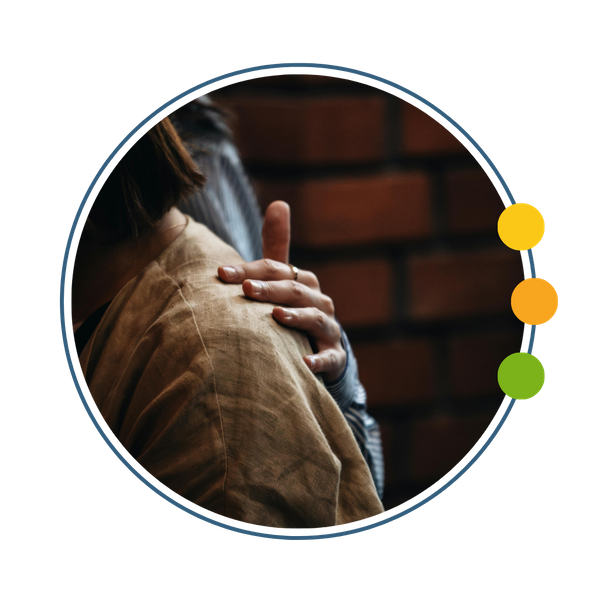 person putting supportive hand on partners shoulder