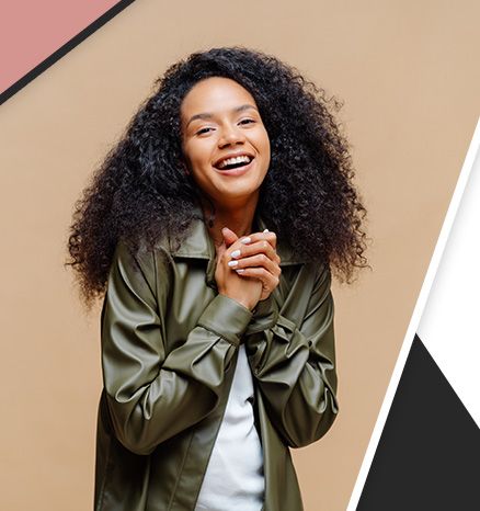 african american woman in gree jacket smiling