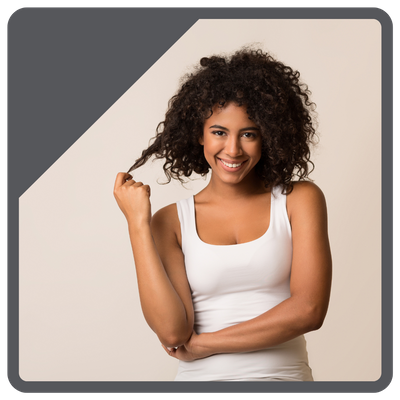 woman pulling on her curly hair woman pulling on her curly hair