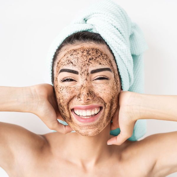 Woman with a face mask treatment on