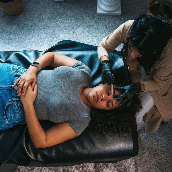 Woman getting dermaplane treatment