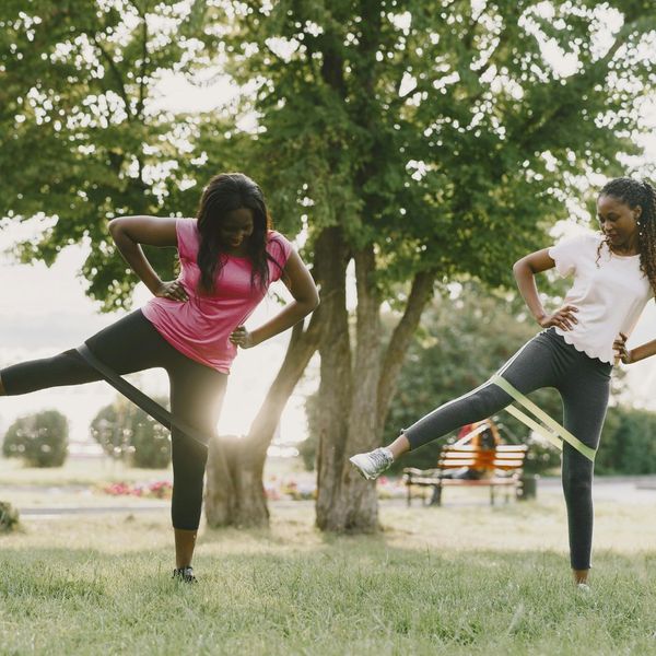 Two friends working out in the park