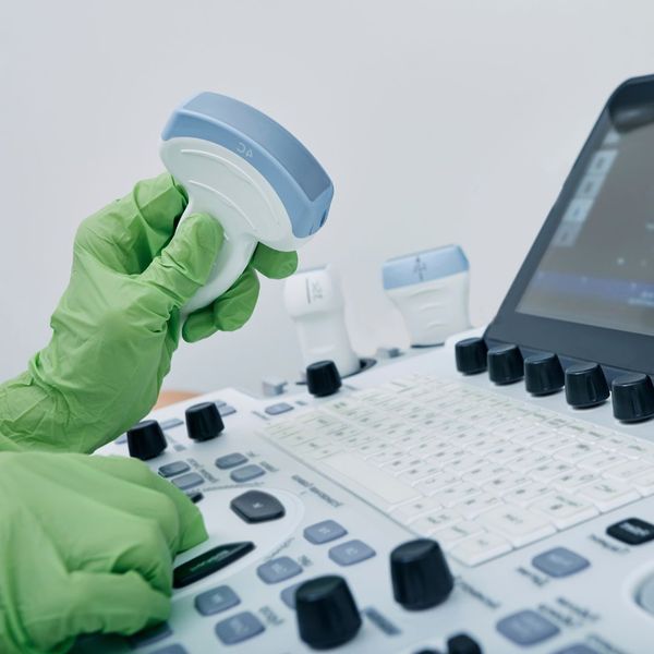holding ultrasound equipment with gloves