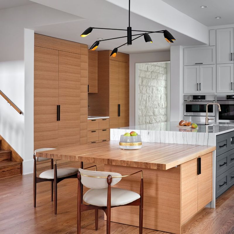 a kitchen with unique overhead lighting