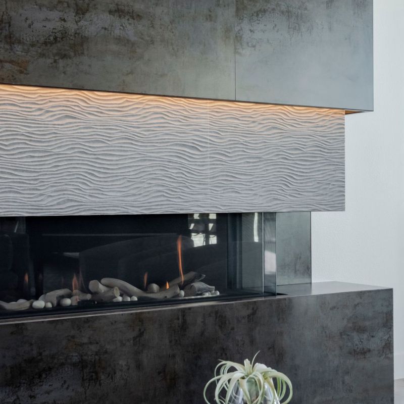 lighting around the edge of a cement fireplace
