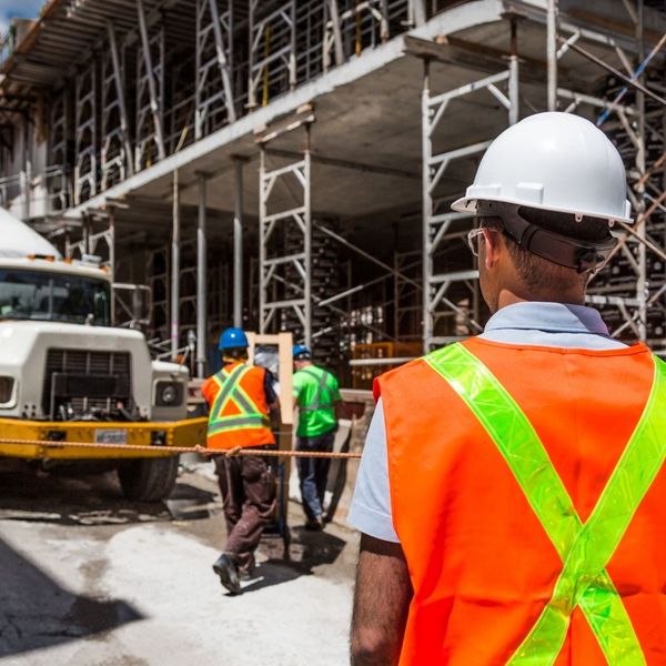 active construction site with hard hats active construction site with hard hats