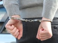 a man's wrist in handcuffs