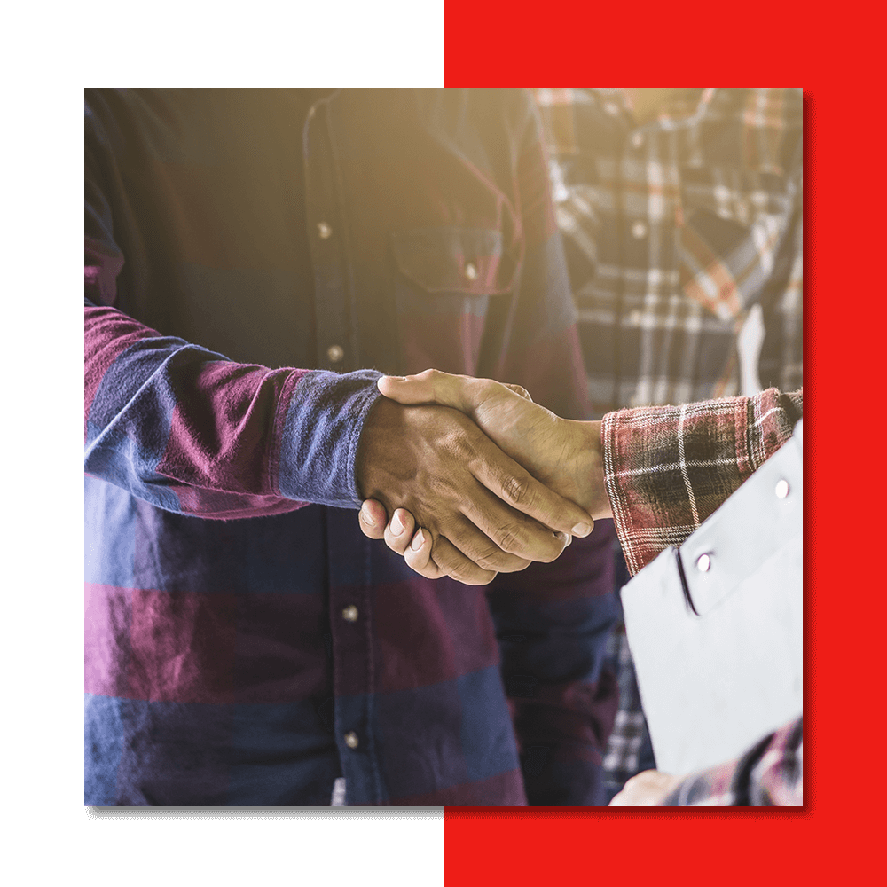 a person holding a clipboard shaking hands with another person