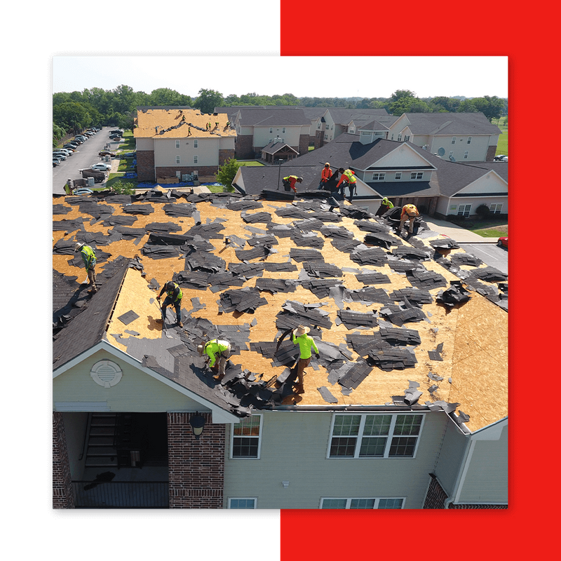 roofers on top of roof with shingles