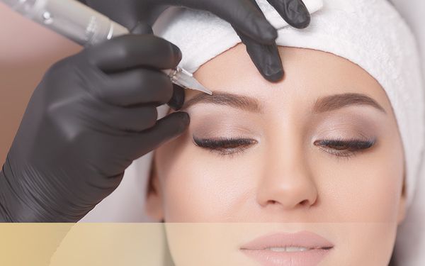 woman getting eyebrows filler with permanent makeup