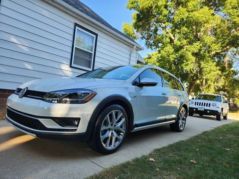 White Volkswagon that was Ceramic Coated in a driveway in Sioux City