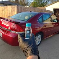Red Chevy Impala and a bottle of Ceramic Coated