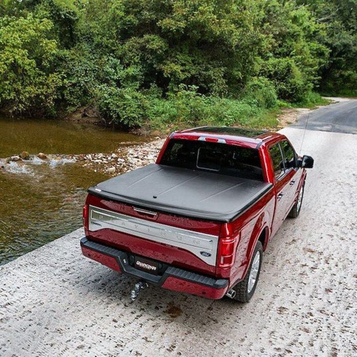 red truck with a bed cover