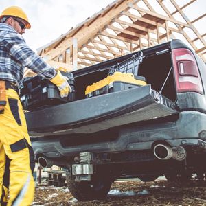 unloading toolboxes from a truck