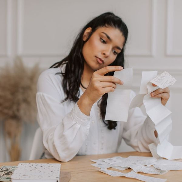 woman looking at receipts