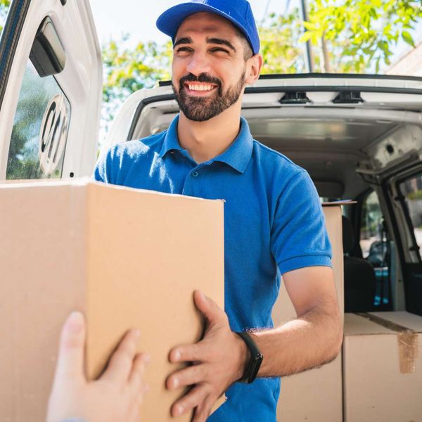 handing delivery driver a package