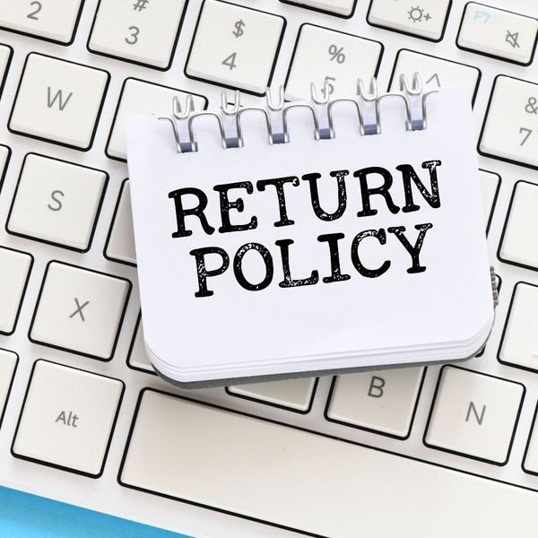 sign that says return policy