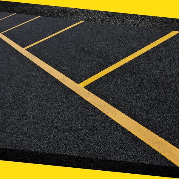 Freshly paved asphalt in a parking lot