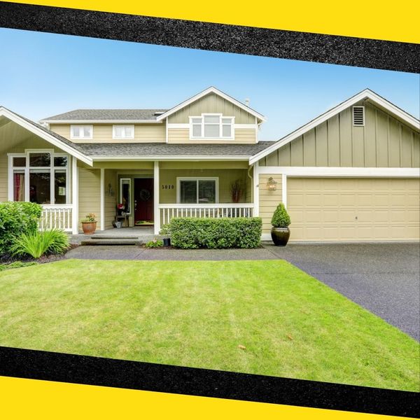 A nicely paved driveway up to a house