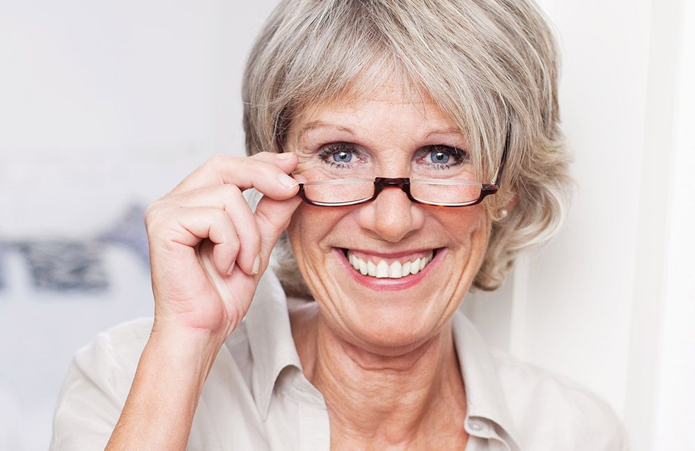 Photo of a woman with glasses Photo of a woman with glasses