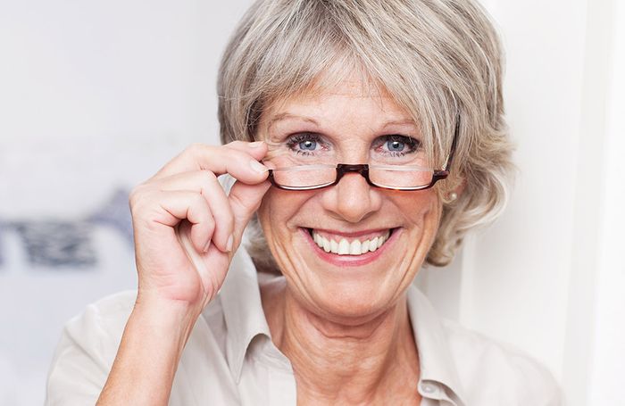 Elderly woman with reading glasses Elderly woman with reading glasses