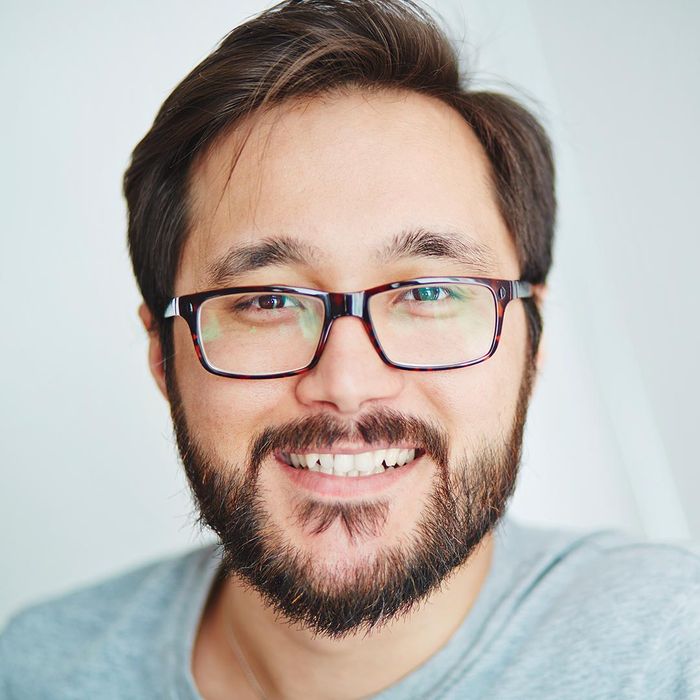 smiling man wearing eye glasses