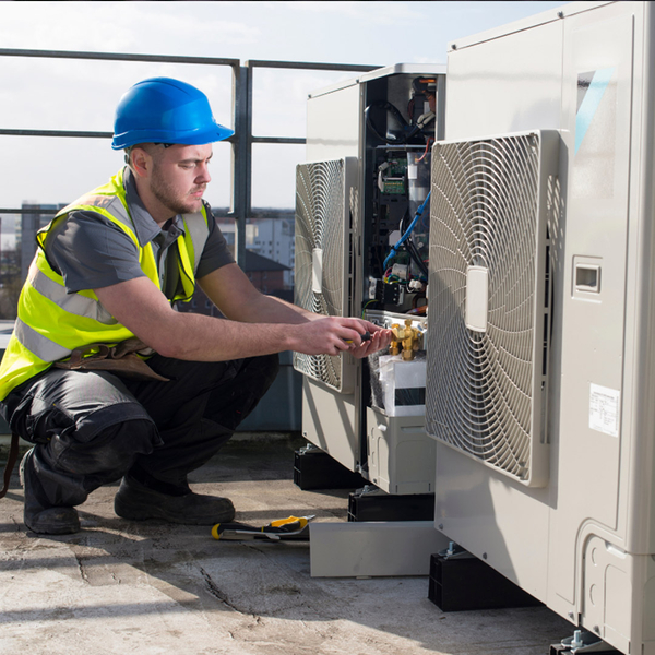 man working on commercial AC