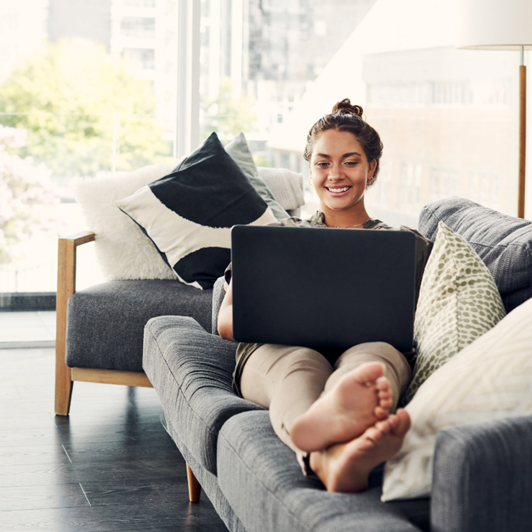 woman relaxing at home on computer woman relaxing at home on computer