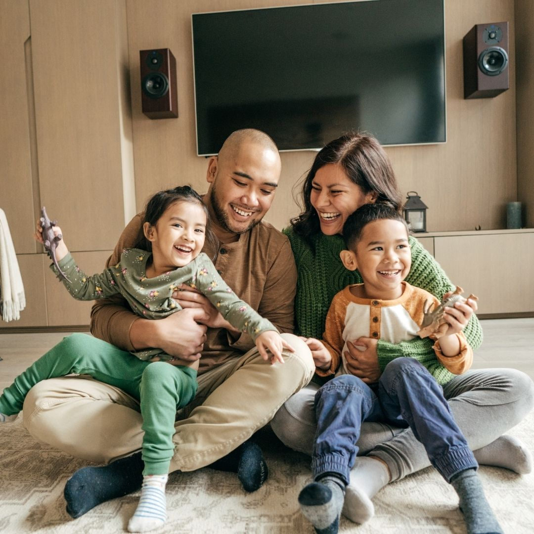 family laughing in home