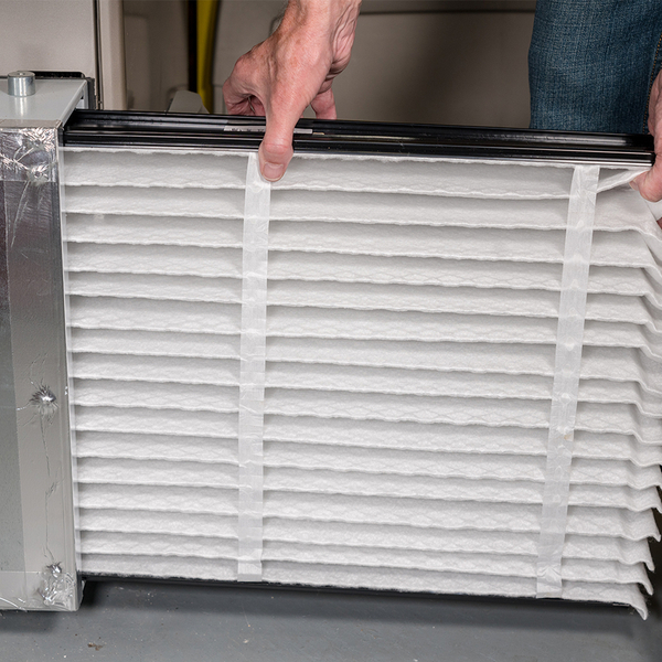 person checking air filter