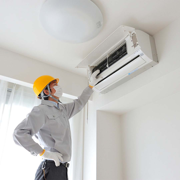 technician working on air conditioner