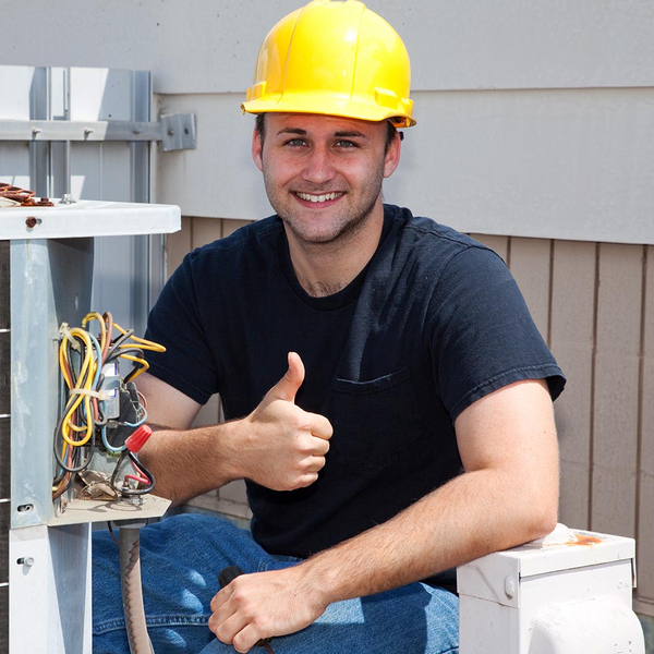 smiling hvac tech giving a thumbs up