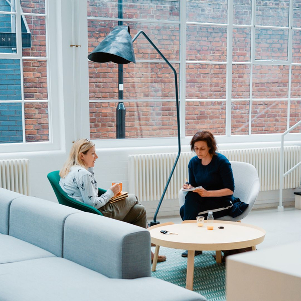 2 women in a meeting in an open space