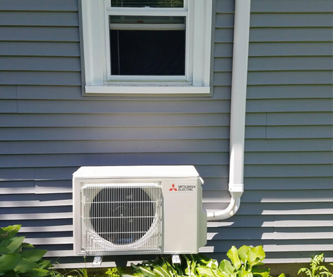 Professionally installed high-efficiency outdoor heat pump by Atlantis Comfort Systems, providing reliable residential heating and cooling solutions throughout Rhode Island and Southern Massachusetts. Professional HVAC Installation Rhode Island