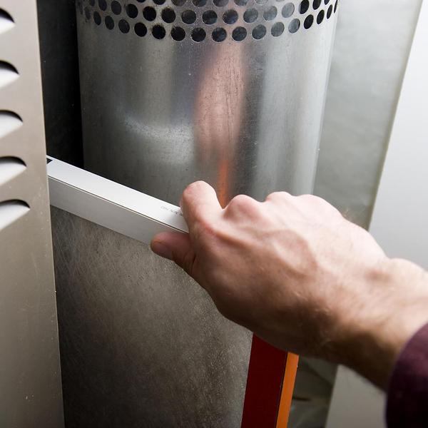 hvac technician replacing a filter