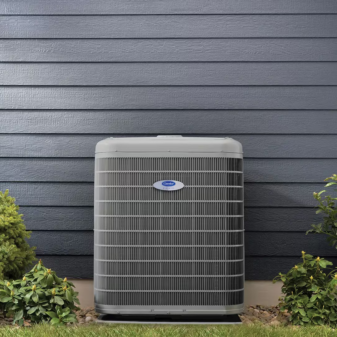 infinity-heat-pump-outside-home-blue-siding-1920x1080.jpeg