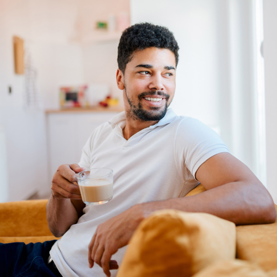 Man smiling with coffee Man smiling with coffee