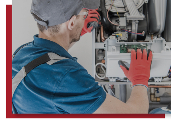 HVAC technician diagnosing a residential heating and cooling system during a repair visit.