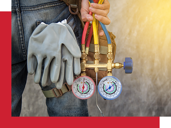 hvac technician working on AC