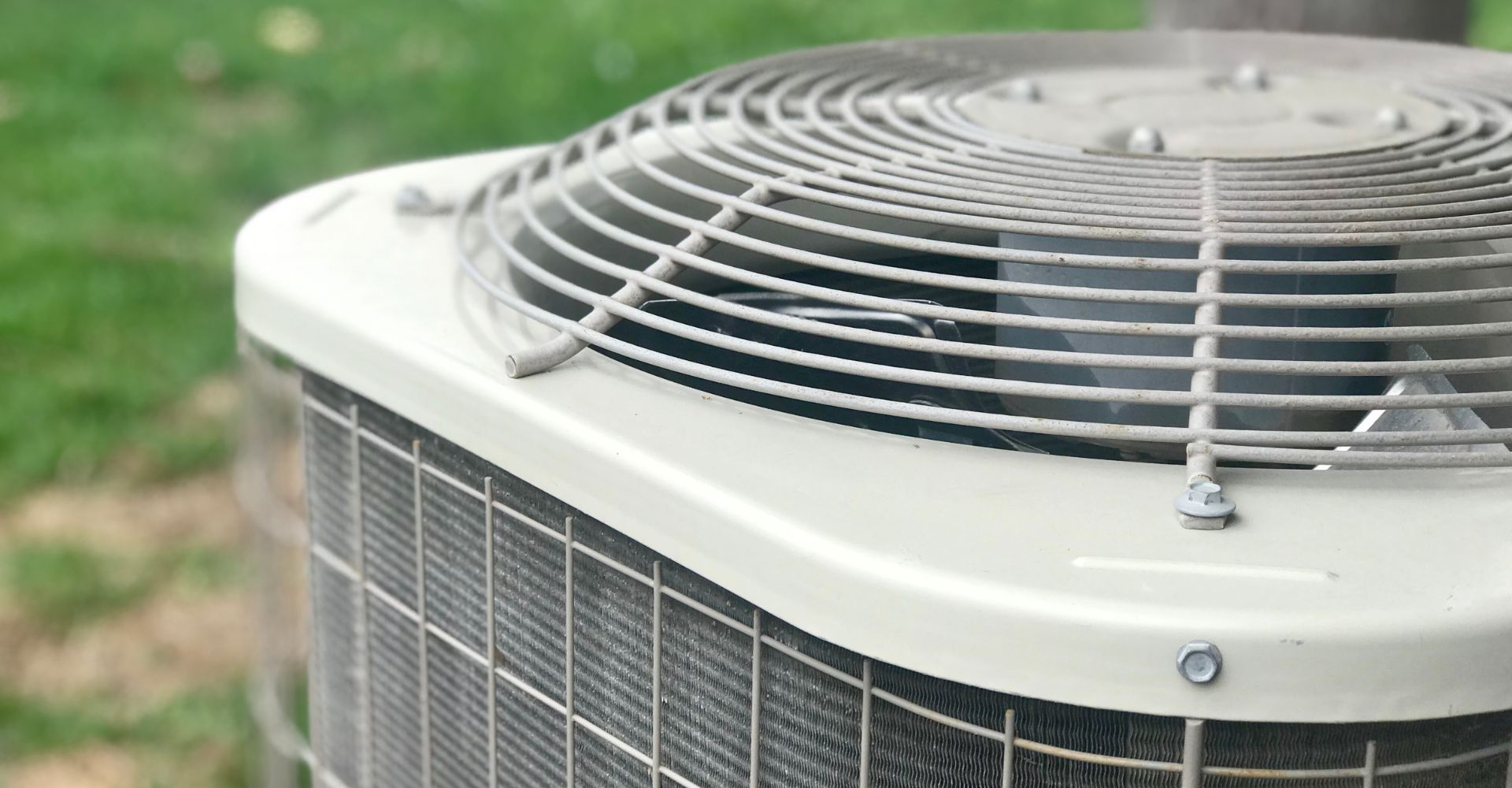 Close-up of a residential air conditioner condenser unit