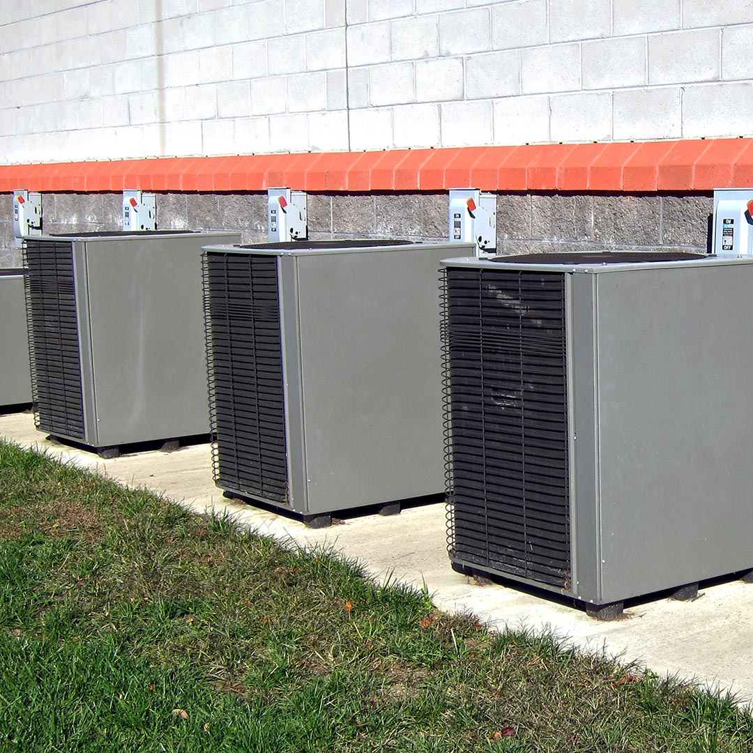 commercial ac units next to a brick building commercial ac units next to a brick building